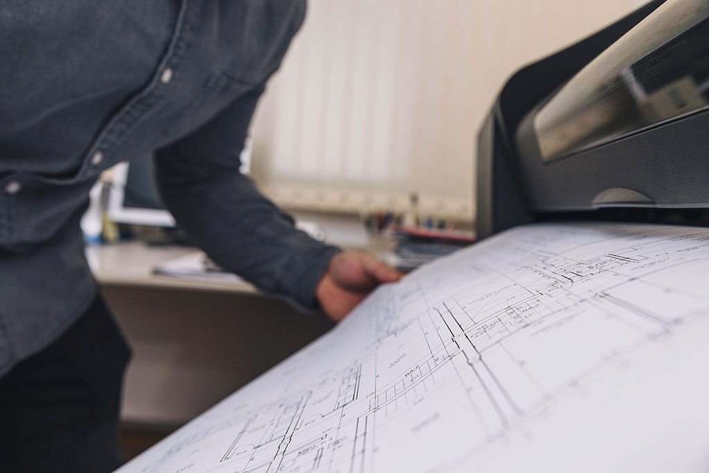 crop-man-printing-drafts crop-man-printing-drafts